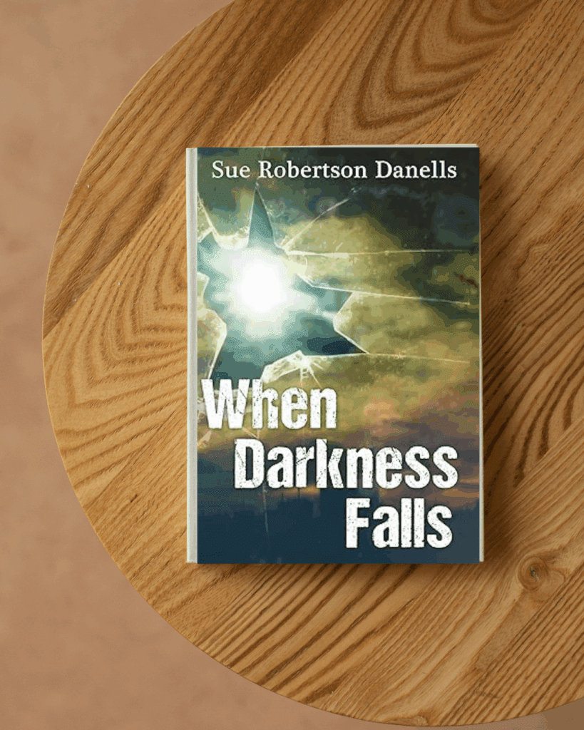 Book cover of When Darkness Falls by Sue Robertson Danells – a haunting historical novel set in 19th-century Brighton